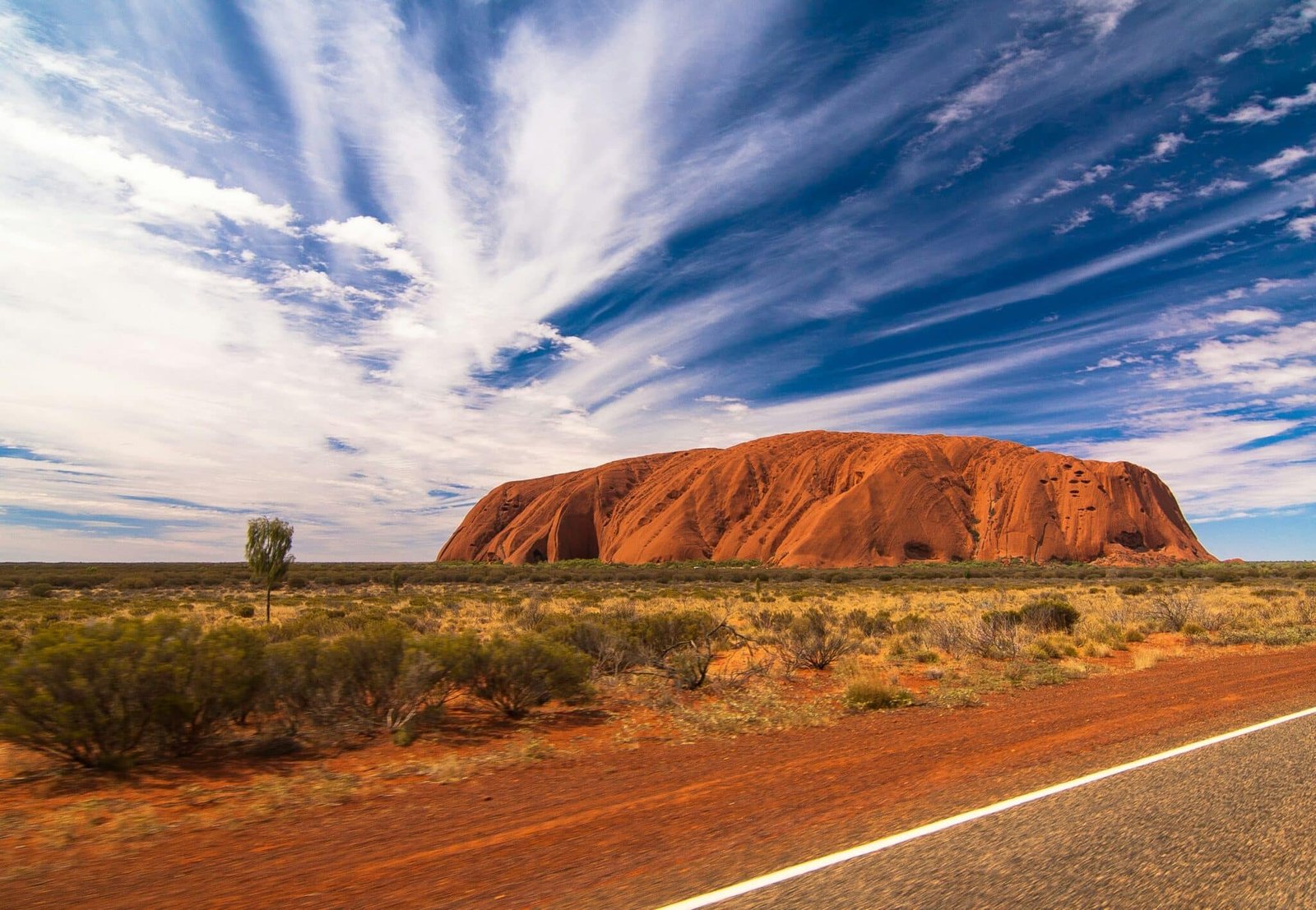 Uluru with wind swept sky